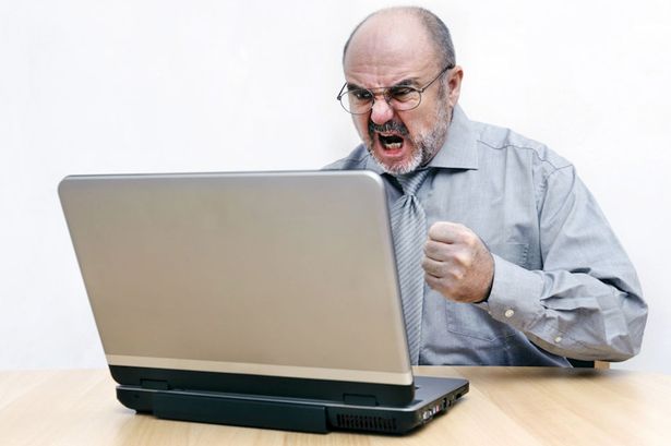 Man-angry-with-his-computer