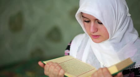 depositphotos_38383029-stock-video-young-muslim-girl-reading-quran